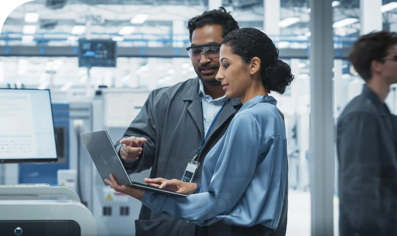 Team reviewing data on a computer.